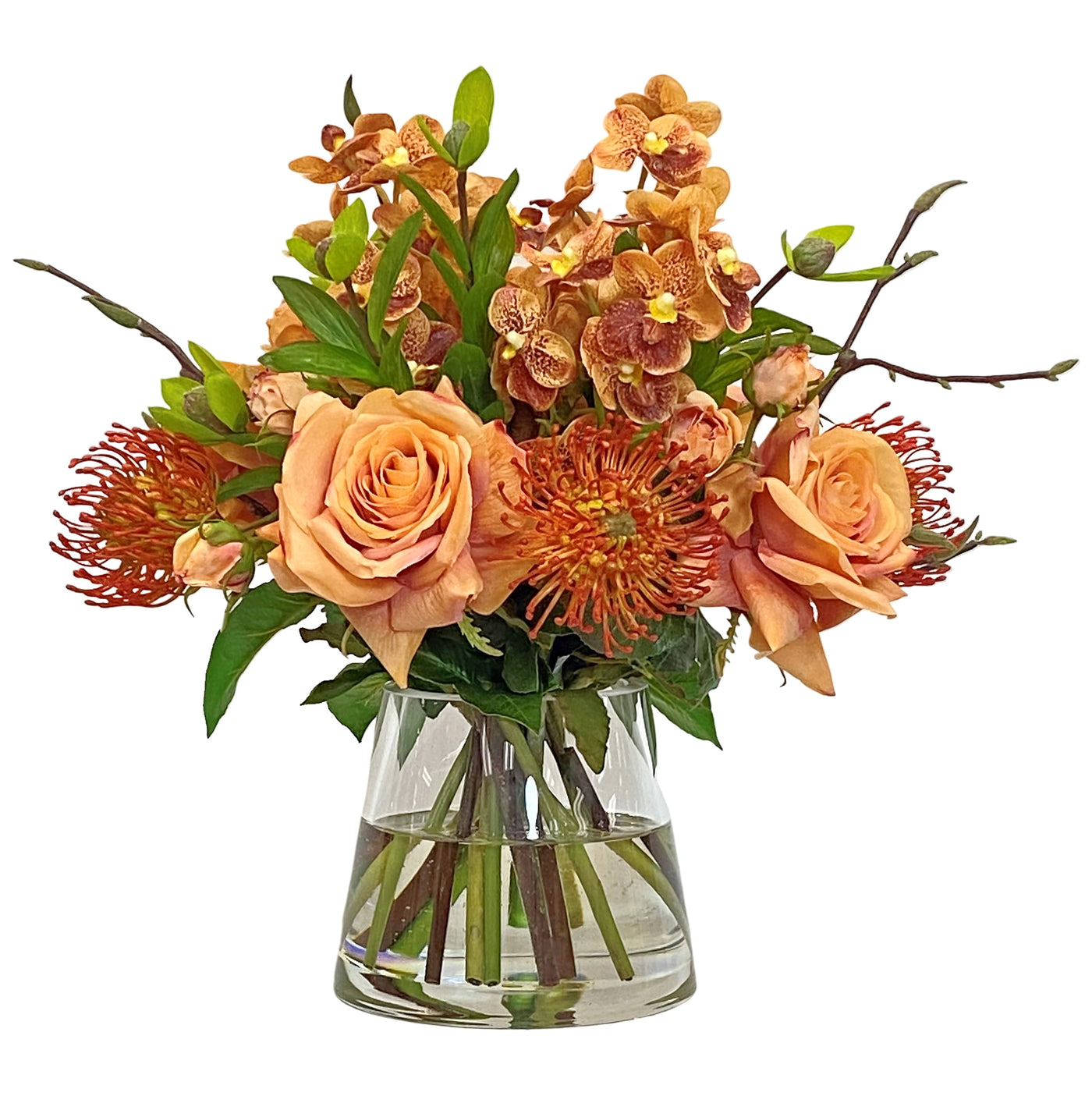 High-quality faux vanda orchid and rose in a glass. Orange warm toned tropical flowers in vase placed against a white background.