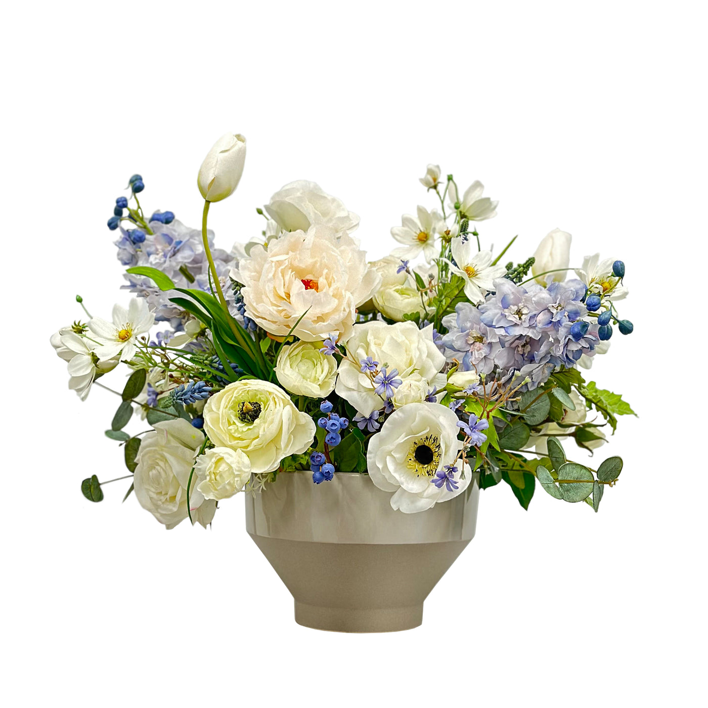 blue and white faux floral centerpiece in tapered bottom planter