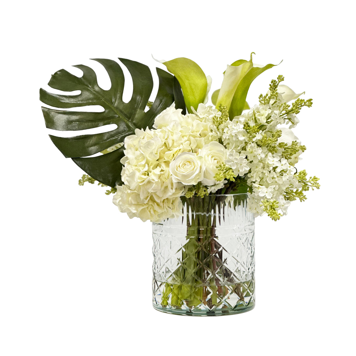 realistic faux split leaf philo and hydrangea faux floral arrangement in cut glass vase