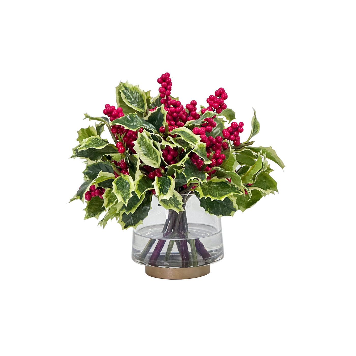 Hand-crafted arrangement of variegated holly leaves and red berries in a glass vase, displayed against a white background