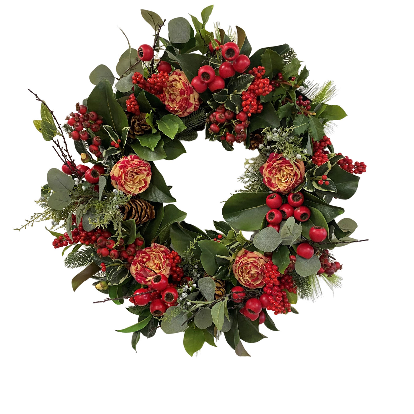 Hand-crafted holiday deluxe wreath with red flowers, berries, and green foliage, displayed against a white background