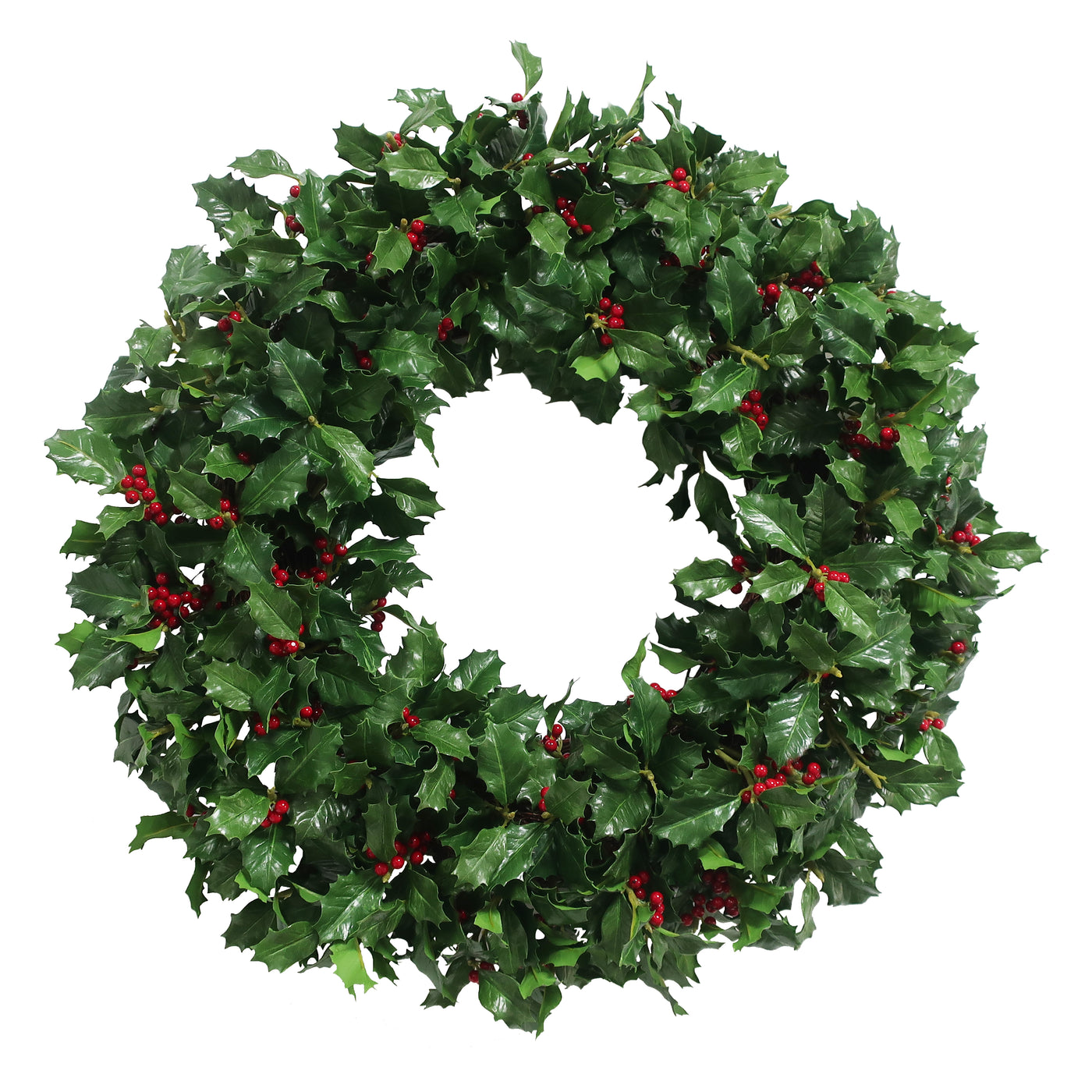 Hand-crafted holly branch wreath with variegated leaves and red berries, displayed against a white background